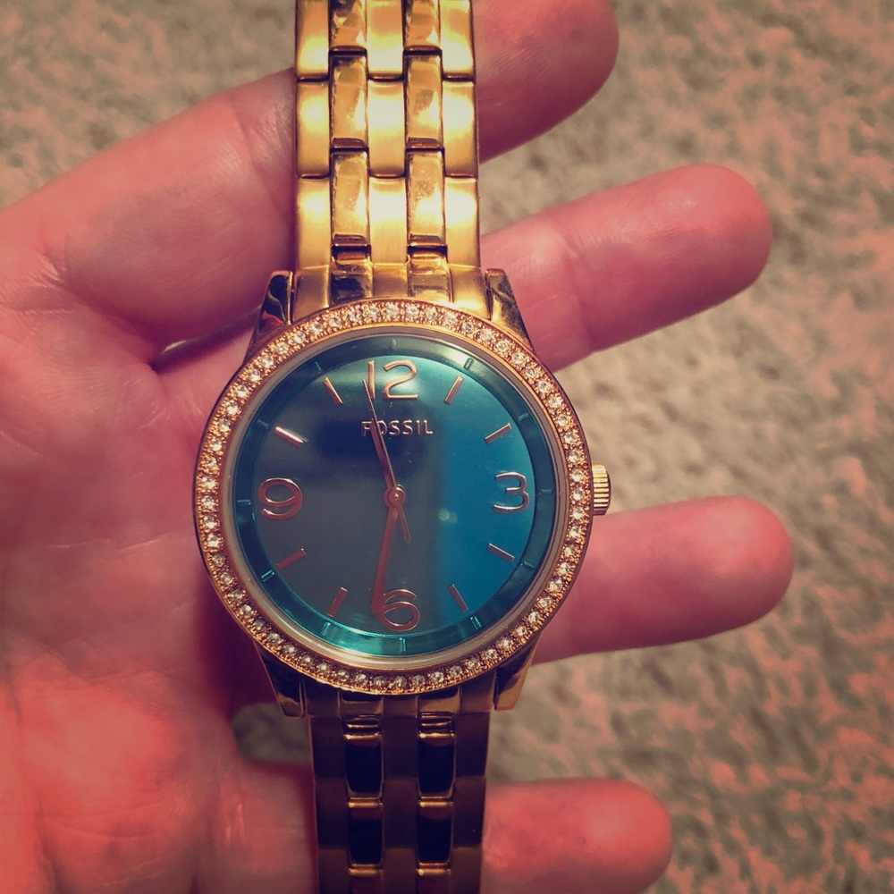 Woman’s gold Fossil watch